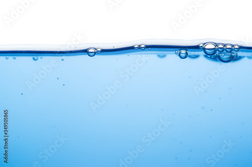 The surface of the water is soft, clear, blue and water bubbles.