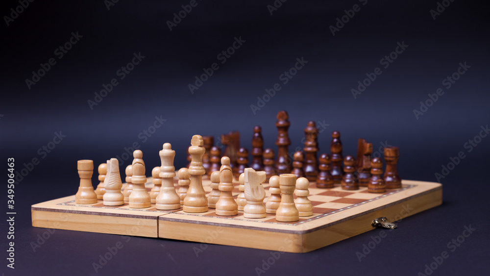 A game of chess, the beginning of a chess game two sides opposite each other. A game of chess, the beginning of a chess game two sides opposite each other.