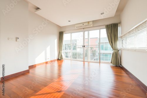 Empty room with whitewashed floating laminate flooring