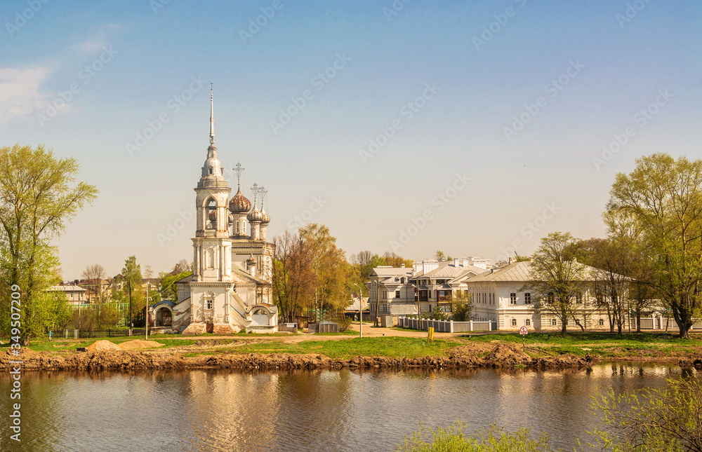 Ancient Sretensky temple on  river bank in  ancient Russian city of Vologda