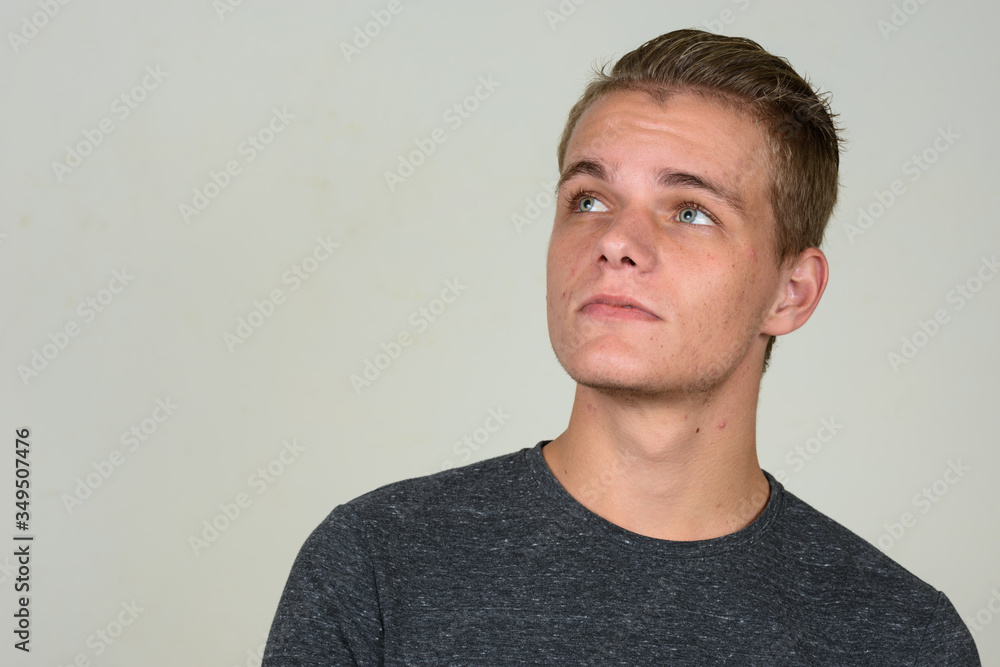 Obraz premium Face of young handsome man with blond hair thinking