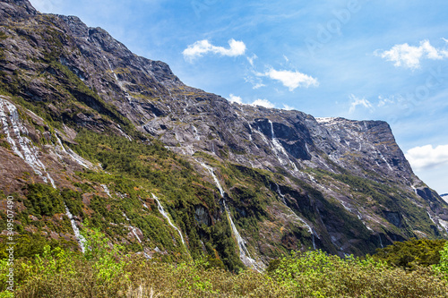 Small waterfalls from sheer cliffs on the way to Fiordland. South Island, New Zealand