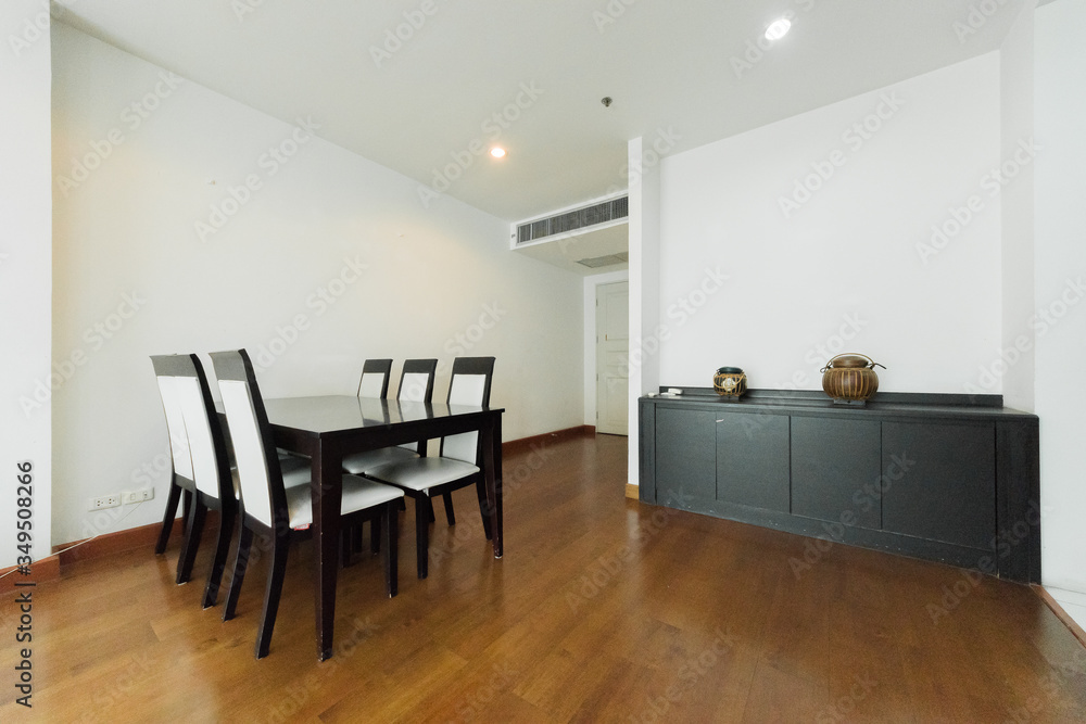 Fototapeta premium Stylish kitchen interior with dining table and chairs