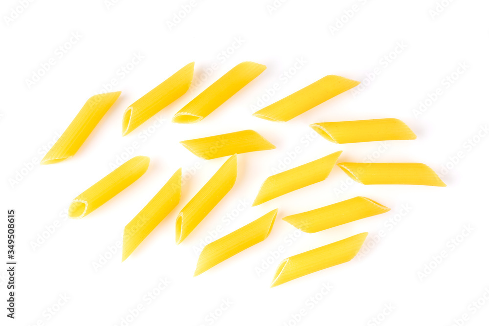 uncooked macaroni on a white background uncooked macaroni on a white background