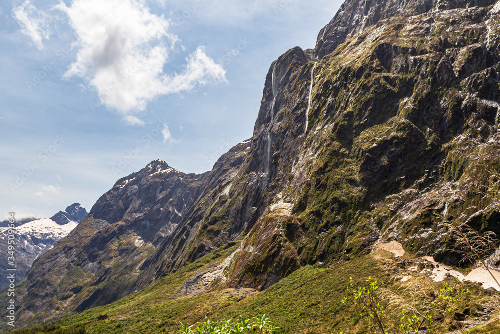 Sheer cliffs on the way to Fiordland. South Island, New Zealand Sheer cliffs on the way to Fiordland. South Island, New Zealand