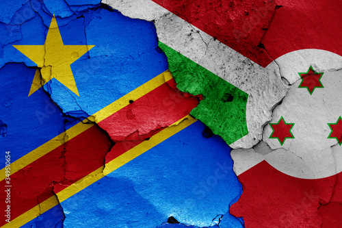 flags of DR Congo and Burundi painted on cracked wall