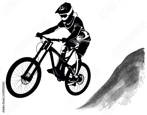 Silhouette of a cyclist riding a mountain bike
