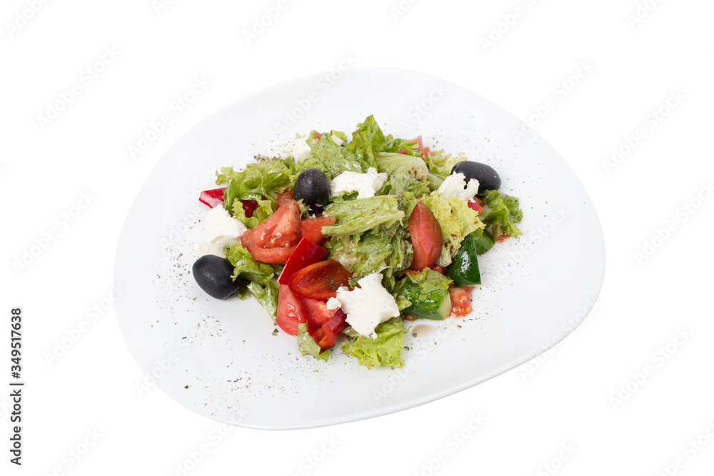 Plate of tasty fresh vegetable salad with feta.