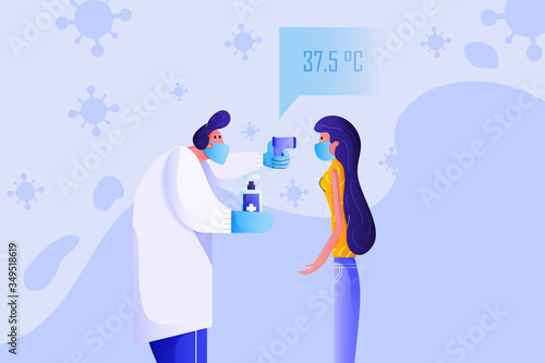 Doctor use infrared thermometer to measure body temperature of his patient and his right hand hold hand washing alcohol gel. Woman has normal body temperature. Screening for Covid-19 symptoms.