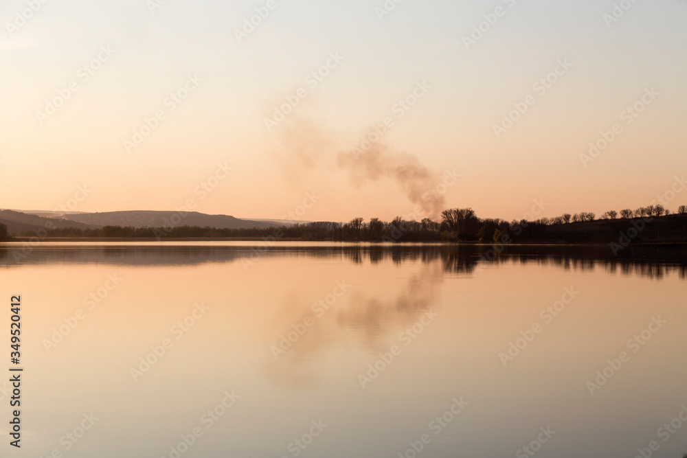 Landscape with a smoke in the background.