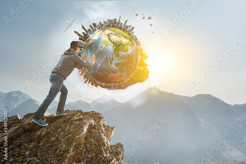 Young businessman in VR glasses rolling the Earth