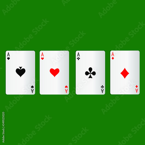 Four aces playing cards on a green background.