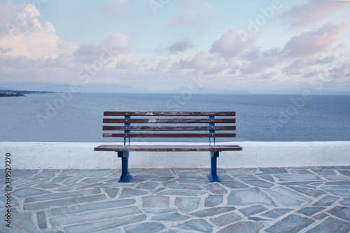 Wooden bench in front of the sea 