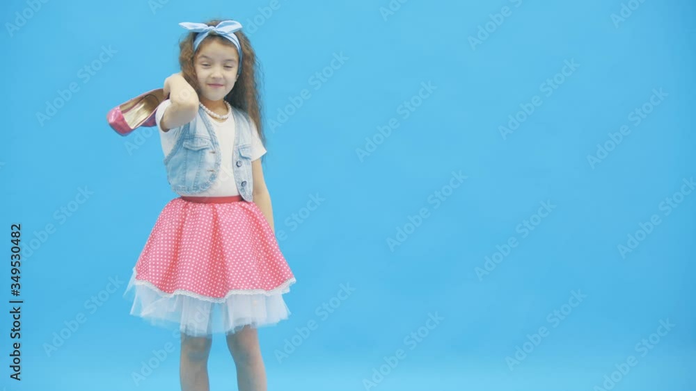 4k video where litttle girl taking pink high heels away. 4k video where litttle girl taking pink high heels away.