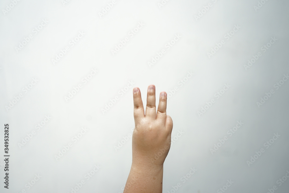 Fat hand is showing three fingers Fat hand is showing three fingers