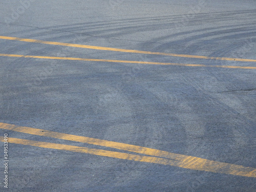 wheel track on the asphalt road texture © srckomkrit