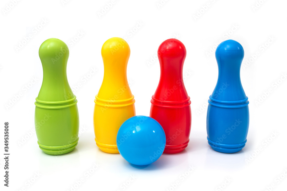Bright colored plastic children's skittles isolated on a white background. Bright colored plastic children's skittles isolated on a white background.