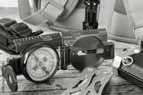 A compass and a multitool for a hike