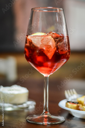 Glass of spritz cocktail close up - Spritz is a wine-based cocktail served as an aperitif in Italy.
