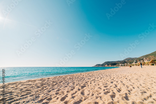 Beach of Cleopatra with blue sea and rocks of Alanya peninsula  Antalya  Turkey