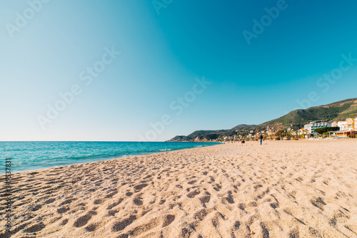 Beach of Cleopatra with blue sea and rocks of Alanya peninsula  Antalya  Turkey