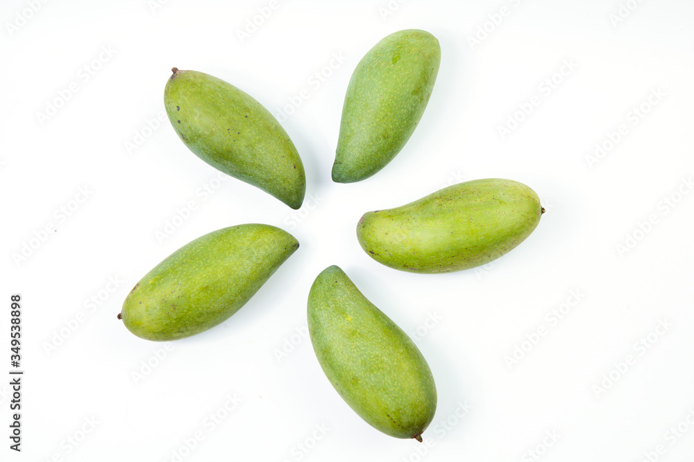 Fresh green mango on white background. Top view of keaw sawaei mango. High angle view of mangoes. Tropical fruit. Fresh green mango on white background. Top view of keaw sawaei mango. High angle view of mangoes. Tropical fruit.