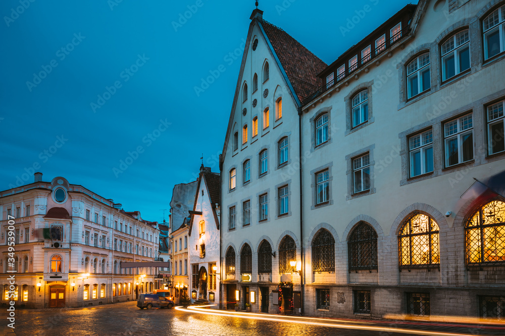 Fototapeta premium Tallinn, Estonia. Vanaturu Street In Historical Centre Of Old Town In Evening Illumination. Traditional Medieval Houses On Old Narrow Street