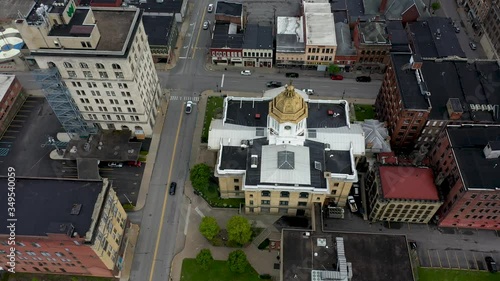 Aerial camera looking straight down at the Marion County courthouse and backing away to reveal the rest of the city in Fairmont, WV. photo