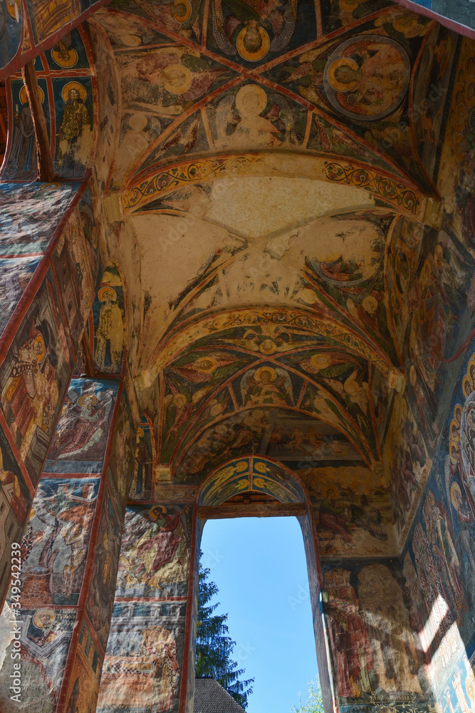 Moldovita monastery in the Vatra Modovitei region south of Bucovina, Romania, Europe. Main entrance, Moldovan architectural style and paintings of Byzantine influence with bucovin colors