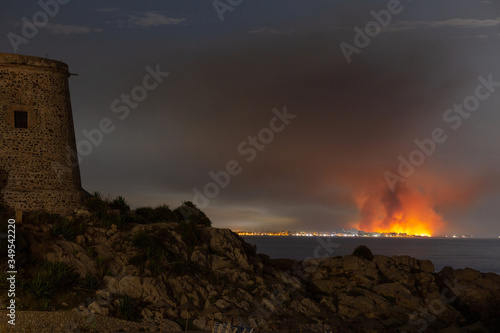  landscape of a fire seen from the town opposite