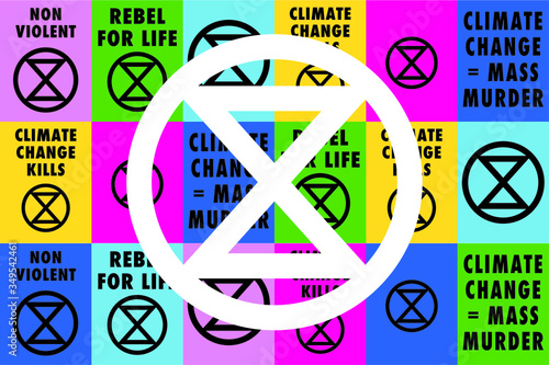 White Extinction rebellion logo on top of climate change placards