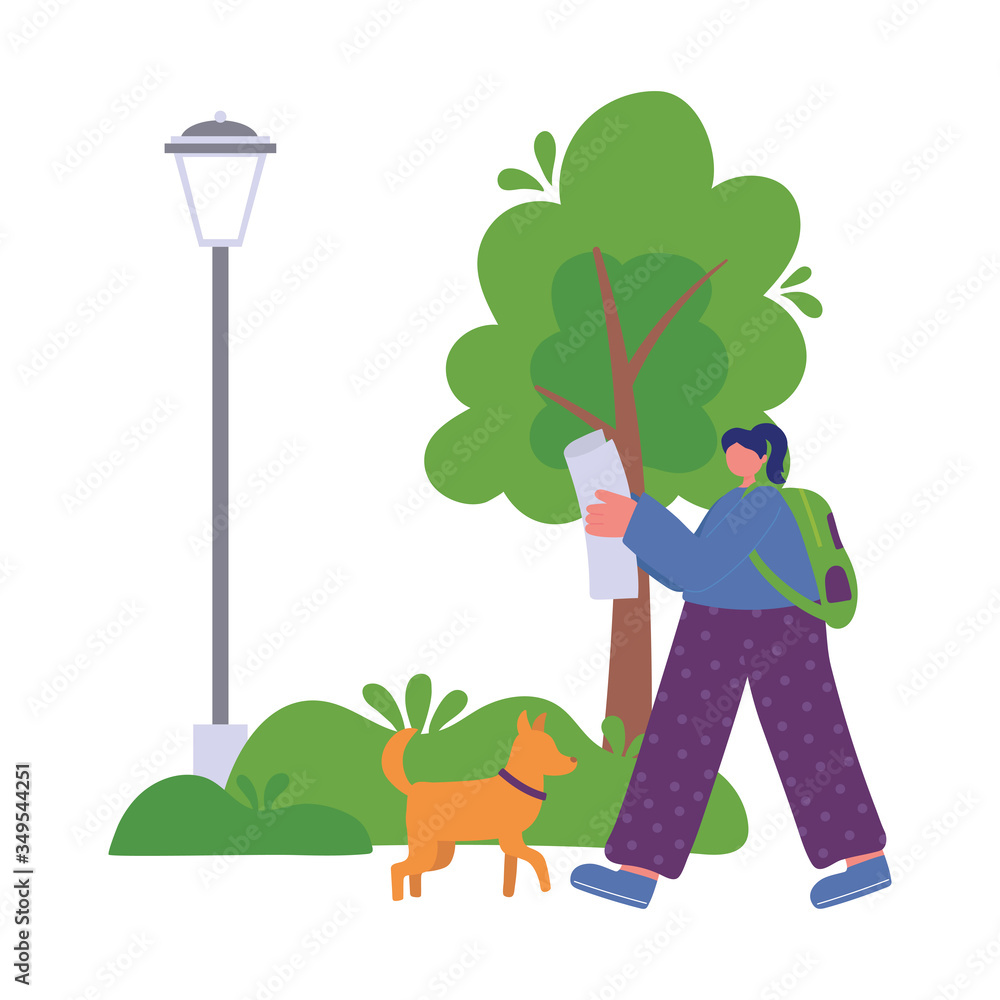 people activities, woman reading newspaper with backpack and dog in the park people activities, woman reading newspaper with backpack and dog in the park