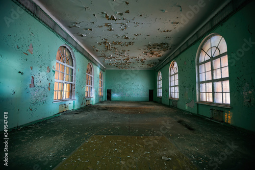 Large empty hall inside old abandoned building