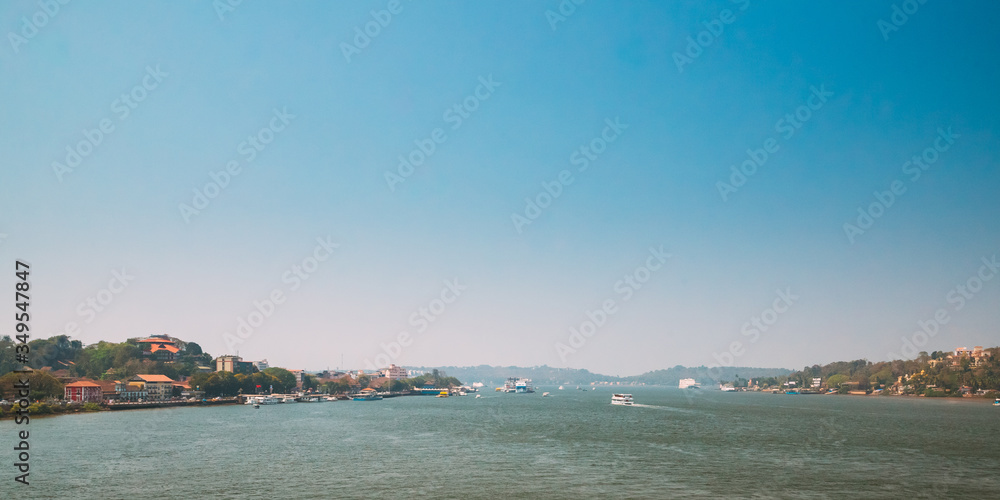 Panaji, Goa, India. Water Navigation On The Mandovi River. Ships Floating On River