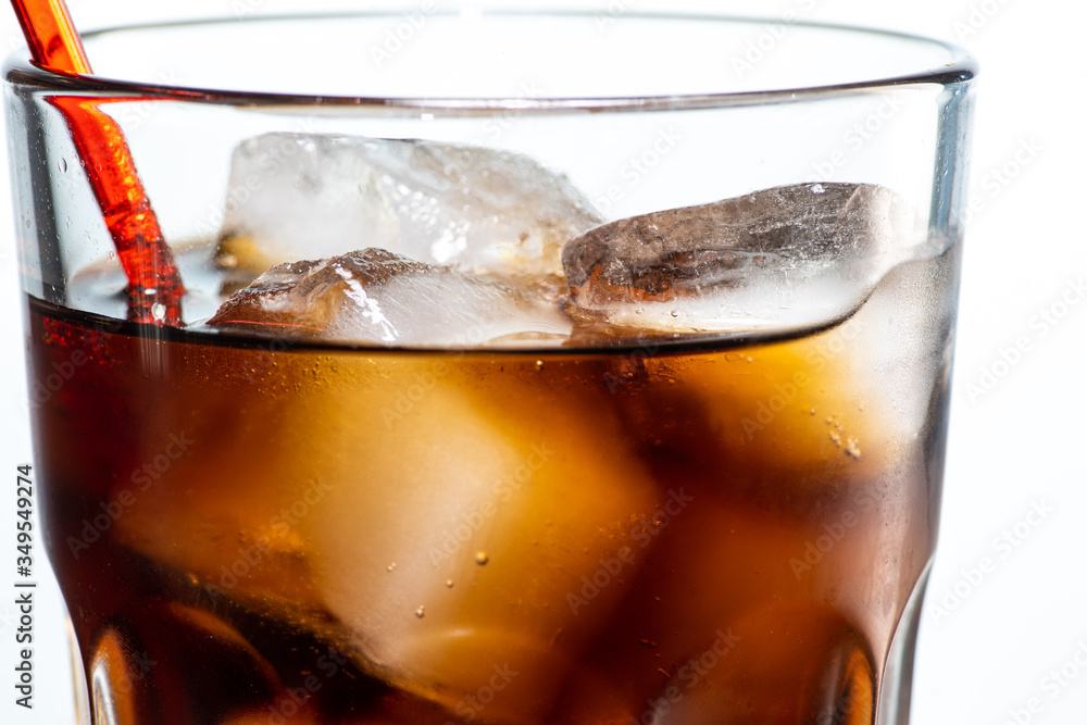 cocktail with ice and cola in a glass on a white background, you can add rum or whiskey cocktail with ice and cola in a glass on a white background, you can add rum or whiskey