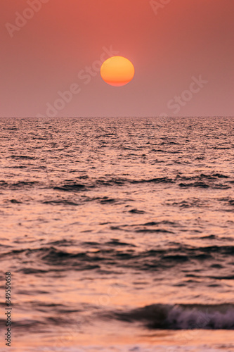Fototapeta Naklejka Na Ścianę i Meble -  Natural Color Sunset Sunrise Sky Over Sea. Seascape With Shining Setting Sun On Sea Horizon