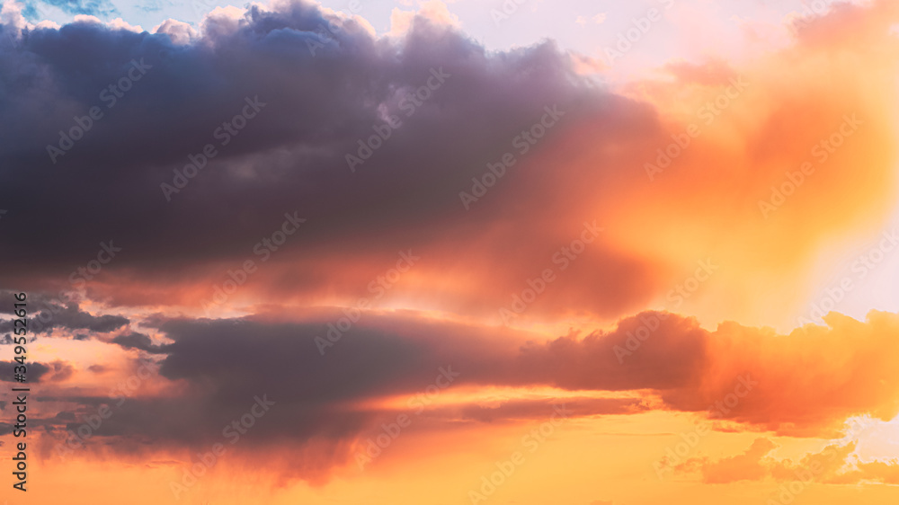 Rain Through Cloudy Sky With Fluffy Clouds During Sunset Sky