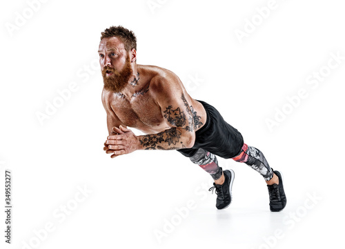 Strong man doing push ups with clap. Photo of sporty man doing exercising isolated on white background. Strength and motivation