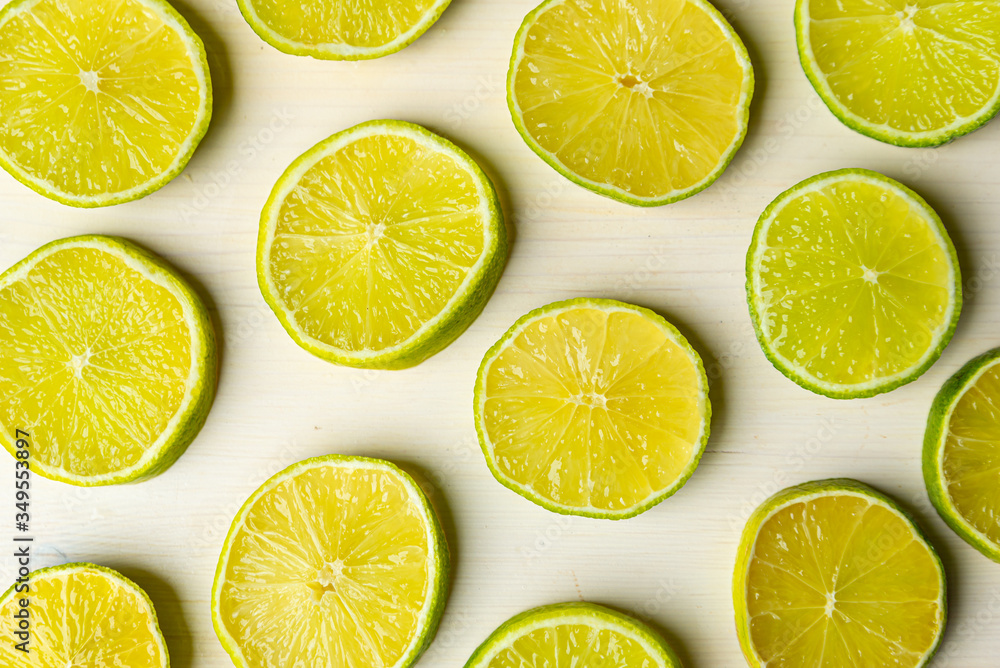 Fototapeta premium Lime slices on a wooden surface