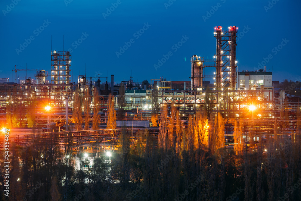 Chemical factory at summer night. Rectification towers