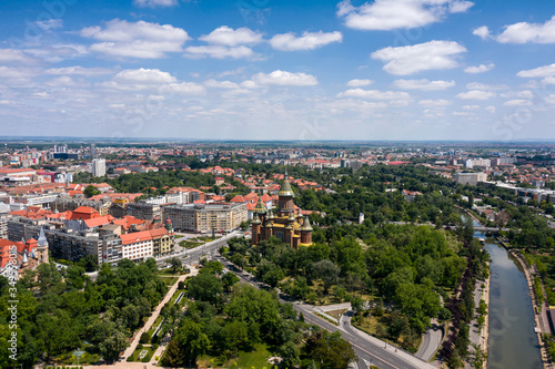 Timisoara city downtown and the central park, arial view with nice clouds on blue sky