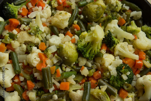 Steamed and chopped vegetables: cauliflower, broccoli, Brussels sprouts, parsnips and carrots. Healthy vegan diet dish.