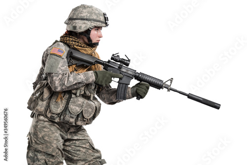 Female in US Army soldier (ISAF) with rifle. Shot in studio. Isolated with clipping path on white background
