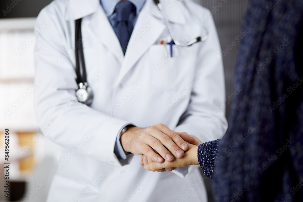 Friendly red-beard doctor reassuring his female patient. Medical ethics and trust concept, medicine theme Friendly red-beard doctor reassuring his female patient. Medical ethics and trust concept, medicine theme