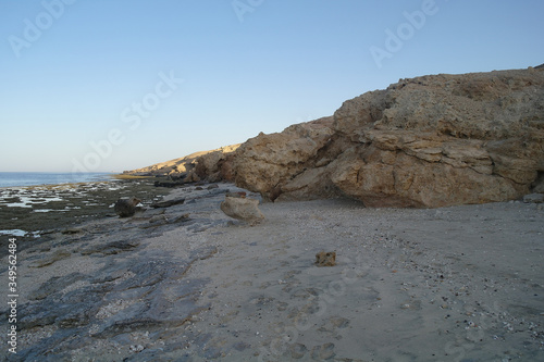 Obraz na płótnie Beautiful seascape. Sea and rock at the sunset. Red sea, Egypt. w salonie