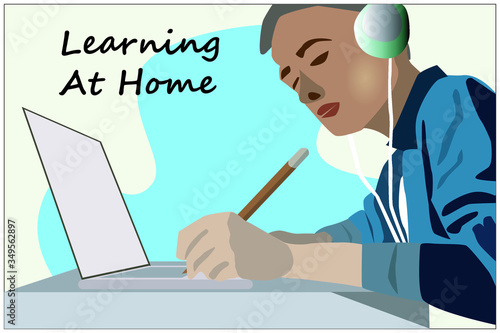 Kid learning at home with computer and headphone