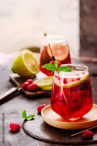 Raspberry homemade lemonade with fresh mint and lemon