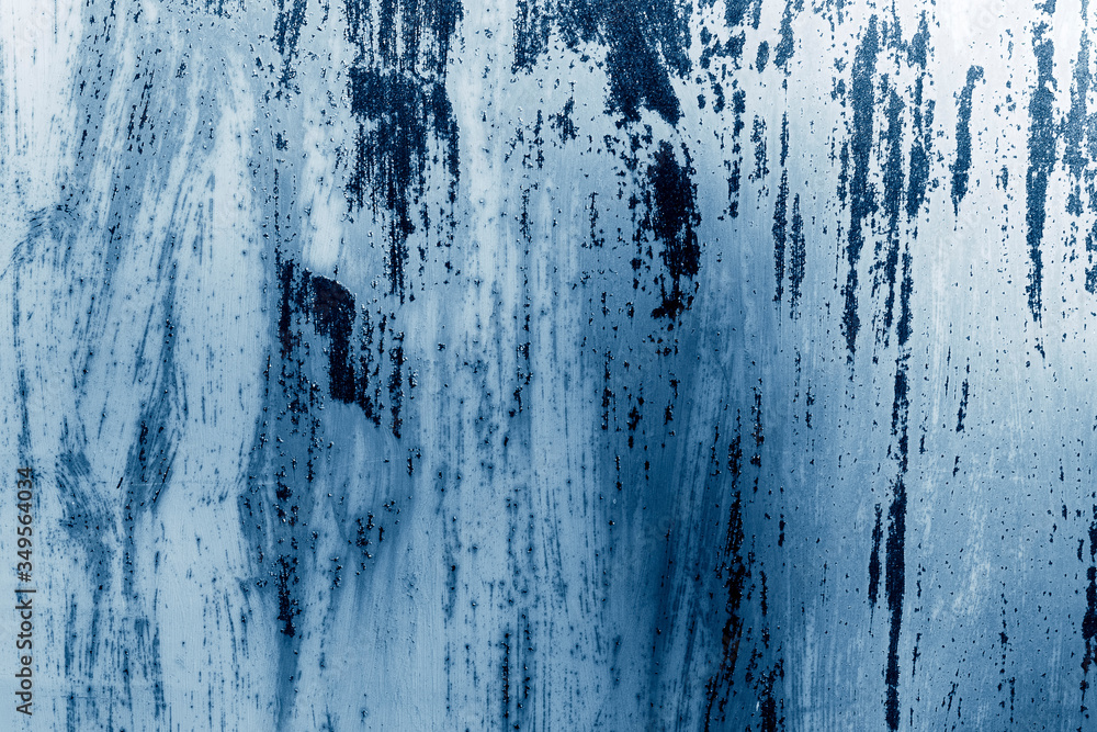 Rusty metal surface tinted in blue. Abstract background.
