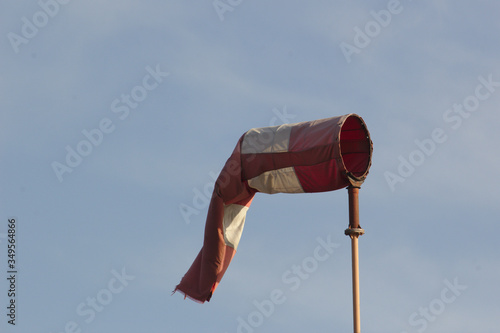 red and white flags on a pole