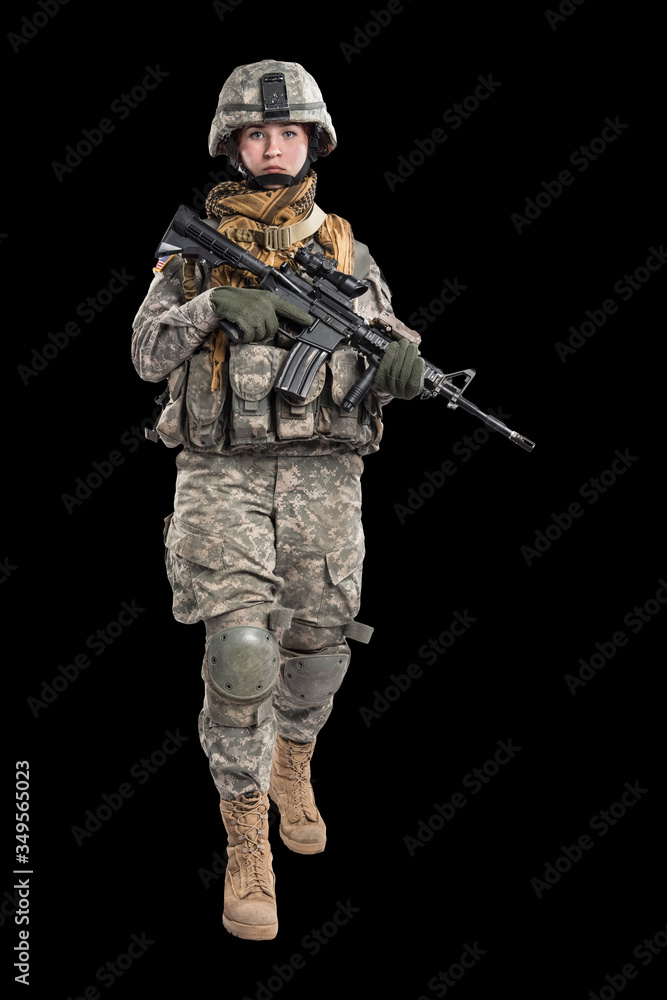 Male in US Army soldier uniform praying. Shot in studio. Isolated on black background